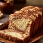 Loaf of homemade Amish cinnamon bread with a fragrant cinnamon swirl.