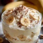 Delicious banana pudding cheesecake fluff dessert in a glass with whipped cream