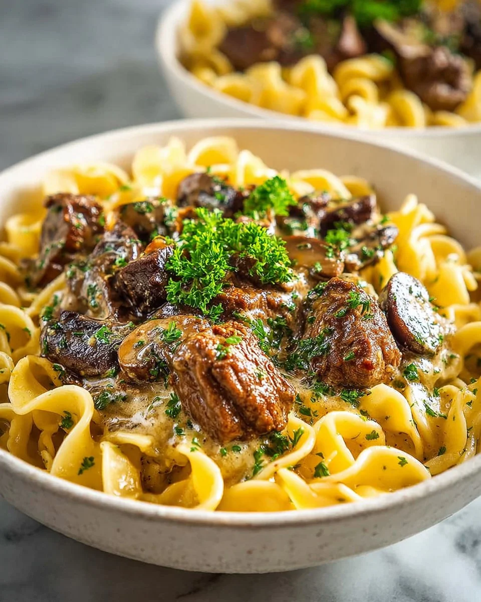 Delicious Beef Stroganoff made with tender stew meat served over noodles.