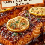 Delicious Honey-Garlic Glazed Salmon garnished with herbs