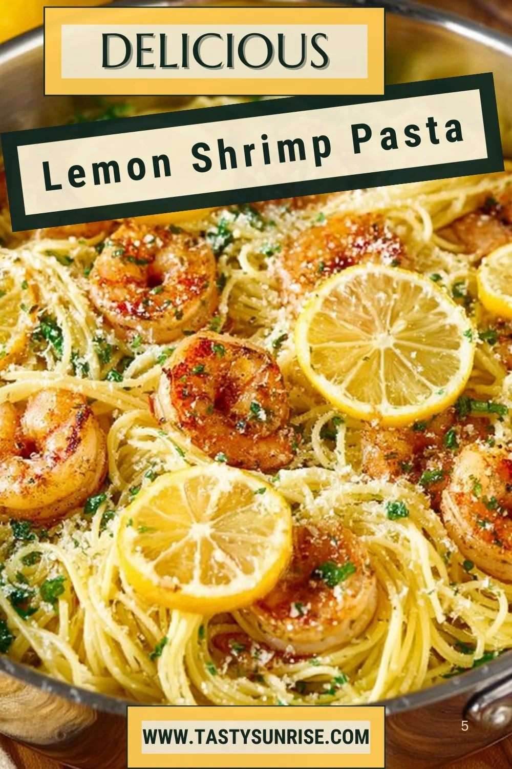Plate of Lemon Shrimp Pasta garnished with herbs and lemon slices