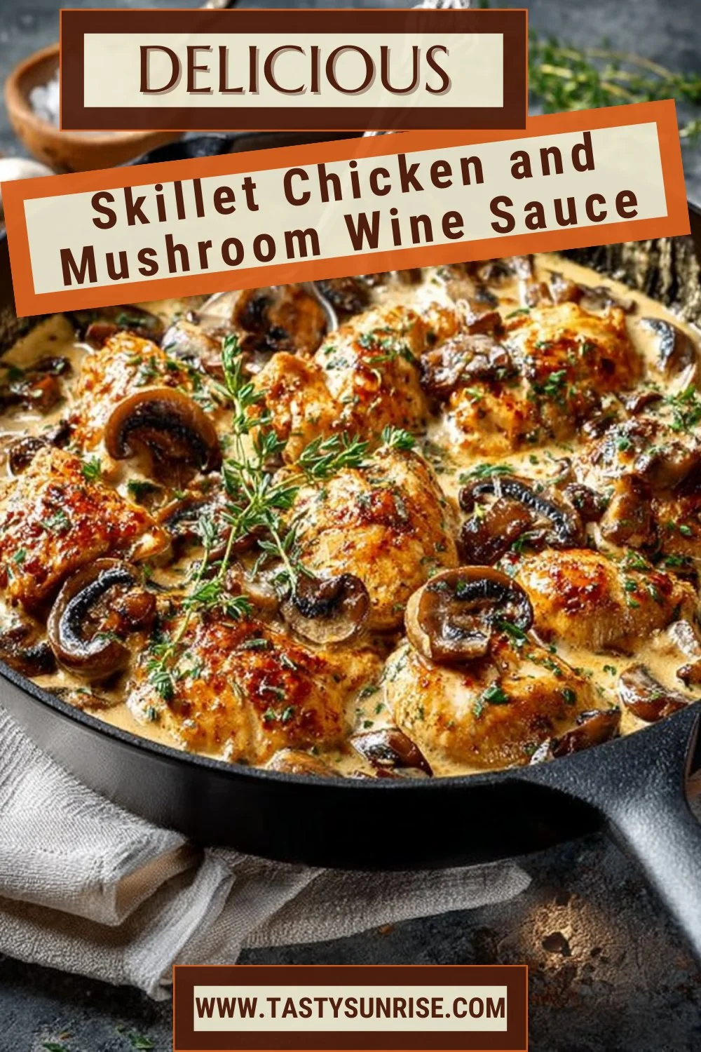 Skillet chicken with mushrooms in a rich wine sauce served in a frying pan