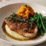 Honey Mustard Glazed Roast Pork Tenderloin garnished and served on a plate