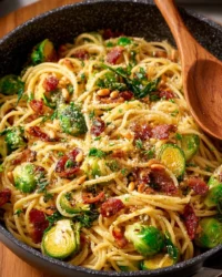 Brussels Sprouts Pasta garnished with Bacon and Sun-Dried Tomatoes in a bowl