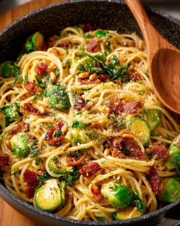 Brussels Sprouts Pasta garnished with Bacon and Sun-Dried Tomatoes in a bowl