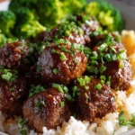Delicious easy teriyaki meatballs in a savory glaze, served on a plate.