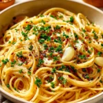 One Pot Spaghetti with Garlic and Oil served in a bowl with fresh herbs