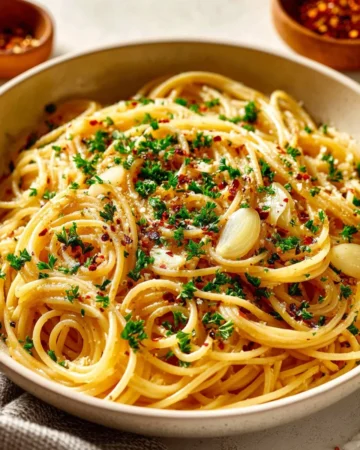 One Pot Spaghetti with Garlic and Oil served in a bowl with fresh herbs