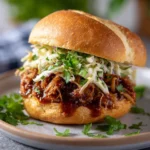 Delicious slow cooker BBQ pulled pork served with coleslaw