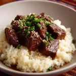 Plate of super spicy Mongolian beef with vegetables and rice