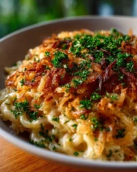 Creamy French Onion Chicken Orzo Casserole with melted cheese and herbs
