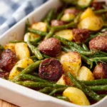 Delicious Sausage Potato Green Bean Casserole in a baking dish