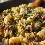Delicious ground beef stroganoff served with noodles and garnished with parsley