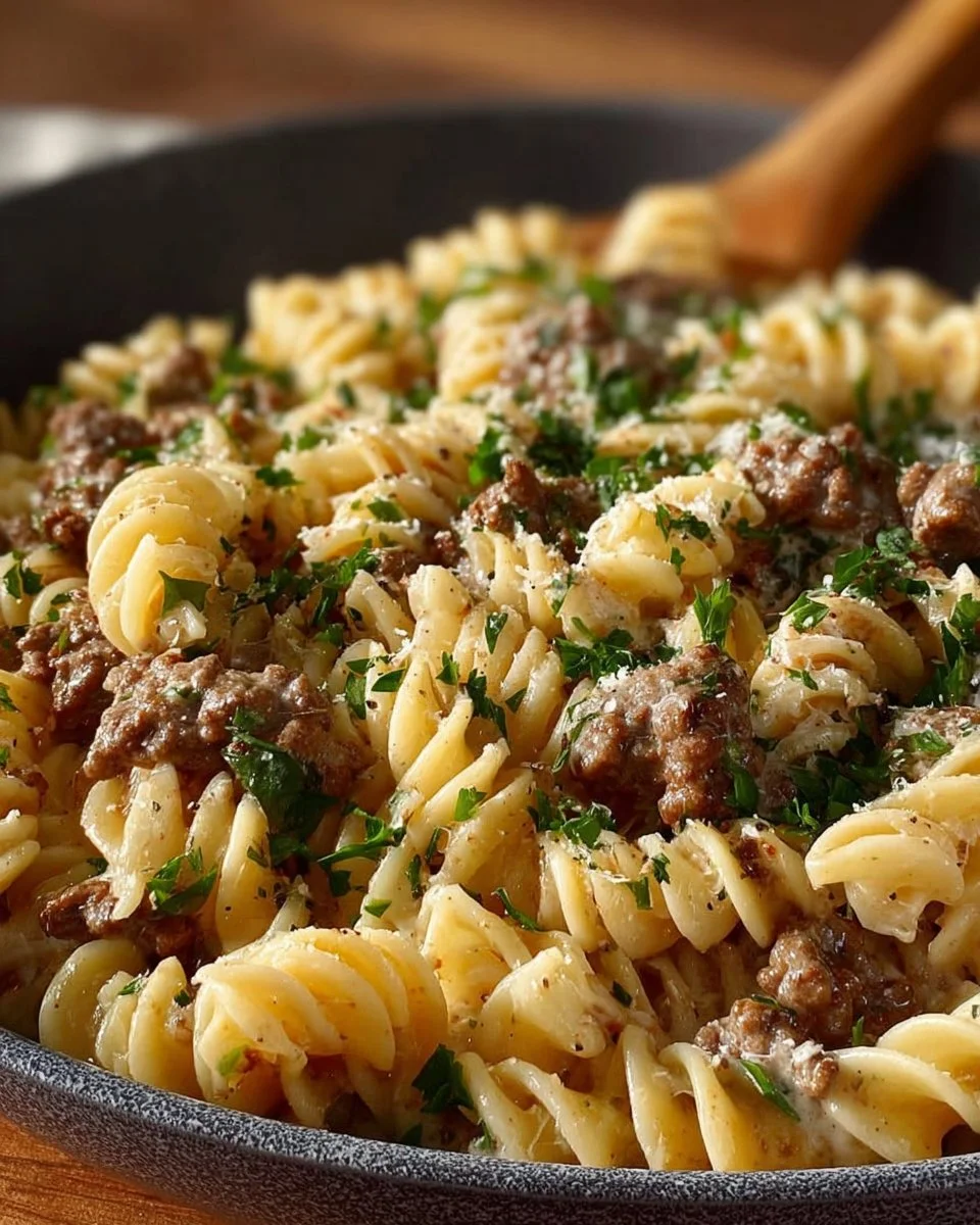 Delicious ground beef stroganoff served with noodles and garnished with parsley