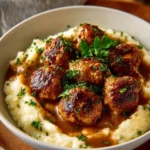 Delicious homemade brown gravy poured over mashed potatoes