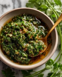 Delicious chimichurri sauce in a bowl, perfect for meat dishes and marinades.