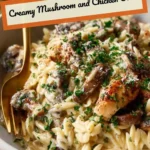 Creamy mushroom chicken orzo dish served in a bowl with fresh herbs