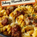 Homemade Johnny Marzetti casserole ready to serve with cheese and pasta.