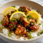 Delicious Lemon Chicken Chinese Style served with rice and vegetables