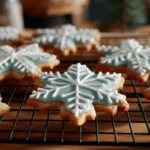 Baked rolled sugar cookies ready for decorating with colorful icing.
