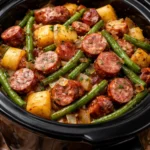 Crockpot sausage and green beans dish ready to be served