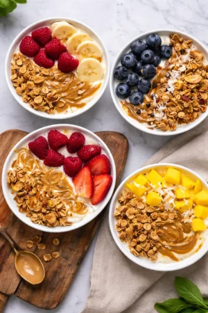 Delicious yogurt granola bowls topped with fresh fruits and nuts
