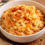 French onion chicken and rice bake dish garnished with herbs