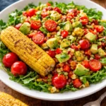 Grilled corn salad with avocado served in a bowl.