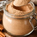 Homemade chai tea latte mix ingredients and finished beverage in a cup