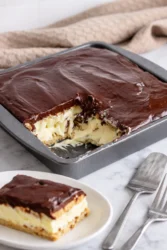 No Bake Chocolate Éclair Cake with chocolate topping and graham crackers