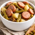 Bowl of Hoosier Stew with smoked sausage, green beans, and potatoes