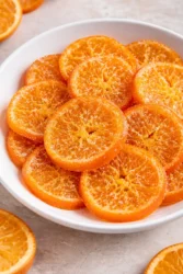 Homemade easy candied orange slices on a plate