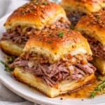 Delicious easy French dip sliders served with au jus for dipping