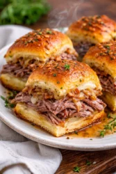 Delicious easy French dip sliders served with au jus for dipping