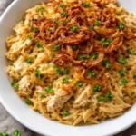 French Onion Chicken Orzo Casserole with melted cheese and herbs.