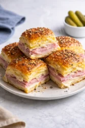 Delicious ham and swiss sliders served on a platter