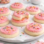 Frosted Lofthouse-style sugar cookies on a decorative plate