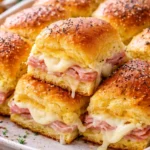 One Pan Ham and Cheese Sliders served on a platter with toppings