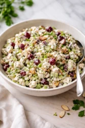 Delicious and fresh chicken salad served in a bowl with greens and vegetables