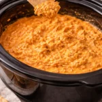 Delicious Crockpot Buffalo Chicken Dip served with tortilla chips.