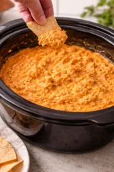 Delicious Crockpot Buffalo Chicken Dip served with tortilla chips.