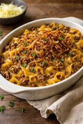 Delicious Family French Onion Hamburger Casserole topped with melted cheese