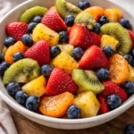 Fresh fruit salad topped with honey lime poppy seed dressing