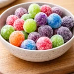 Bowl of vibrant Kool-Aid Grapes ready to be enjoyed as a fun snack.