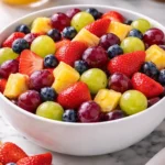Colorful quick fruit salad with a variety of fresh fruits served in a bowl