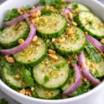 Fresh and colorful Thai Cucumber Salad with herbs and spices