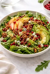Winter Christmas salad with honey mustard dressing served in a bowl