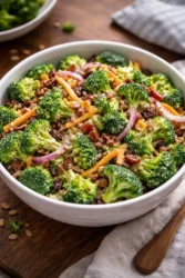 Fresh broccoli salad with colorful vegetables and dressing