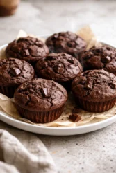 Delicious double chocolate chip muffins with melted chocolate chips on top