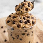 Bowl of protein cookie dough ready to be enjoyed as a healthy treat.